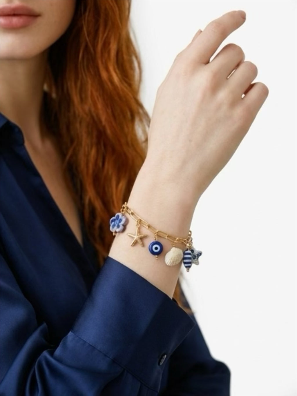 Pulsera gold field con dijes de cerámica pez