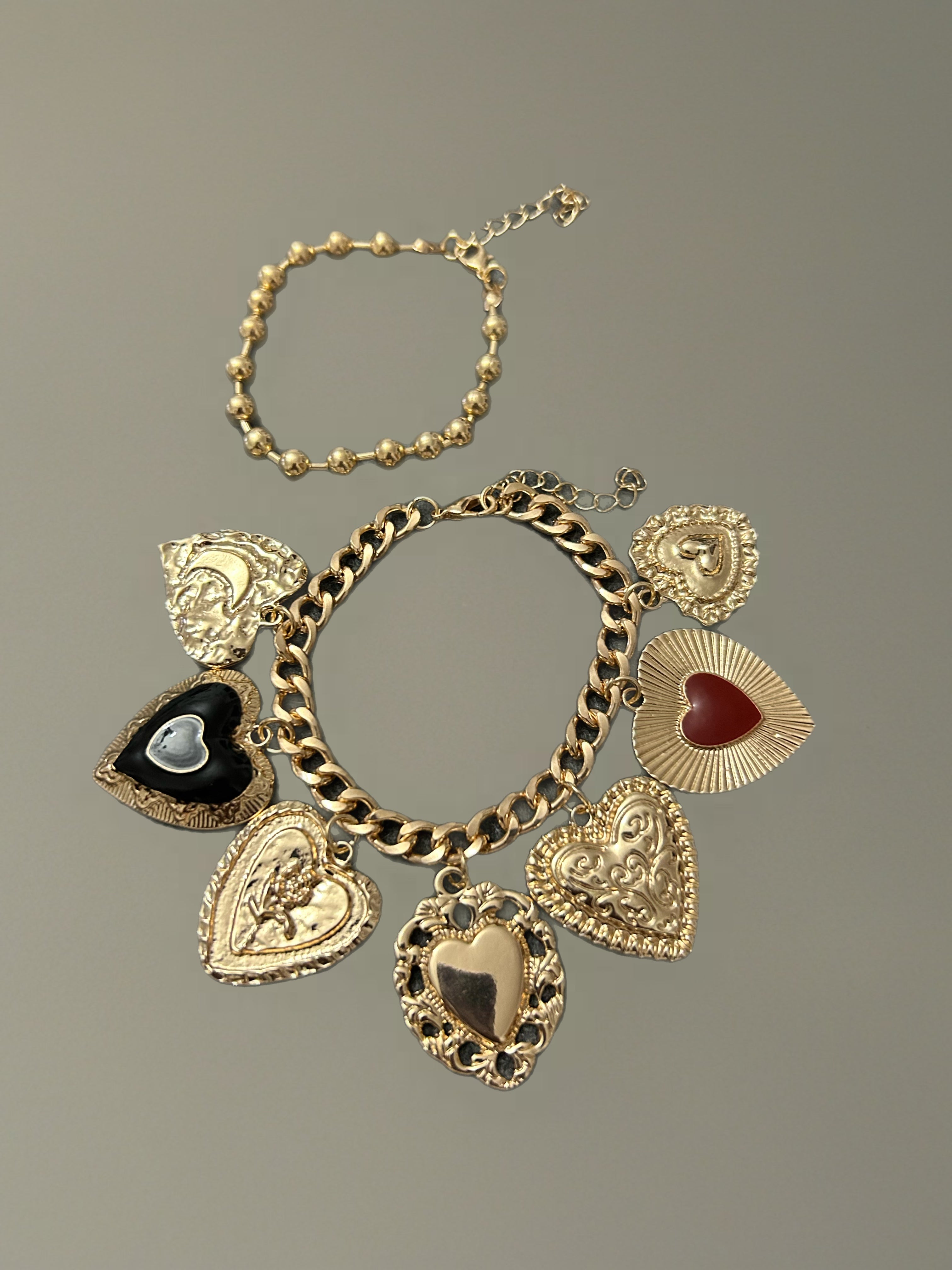 Dúo pulseras dijes corazón