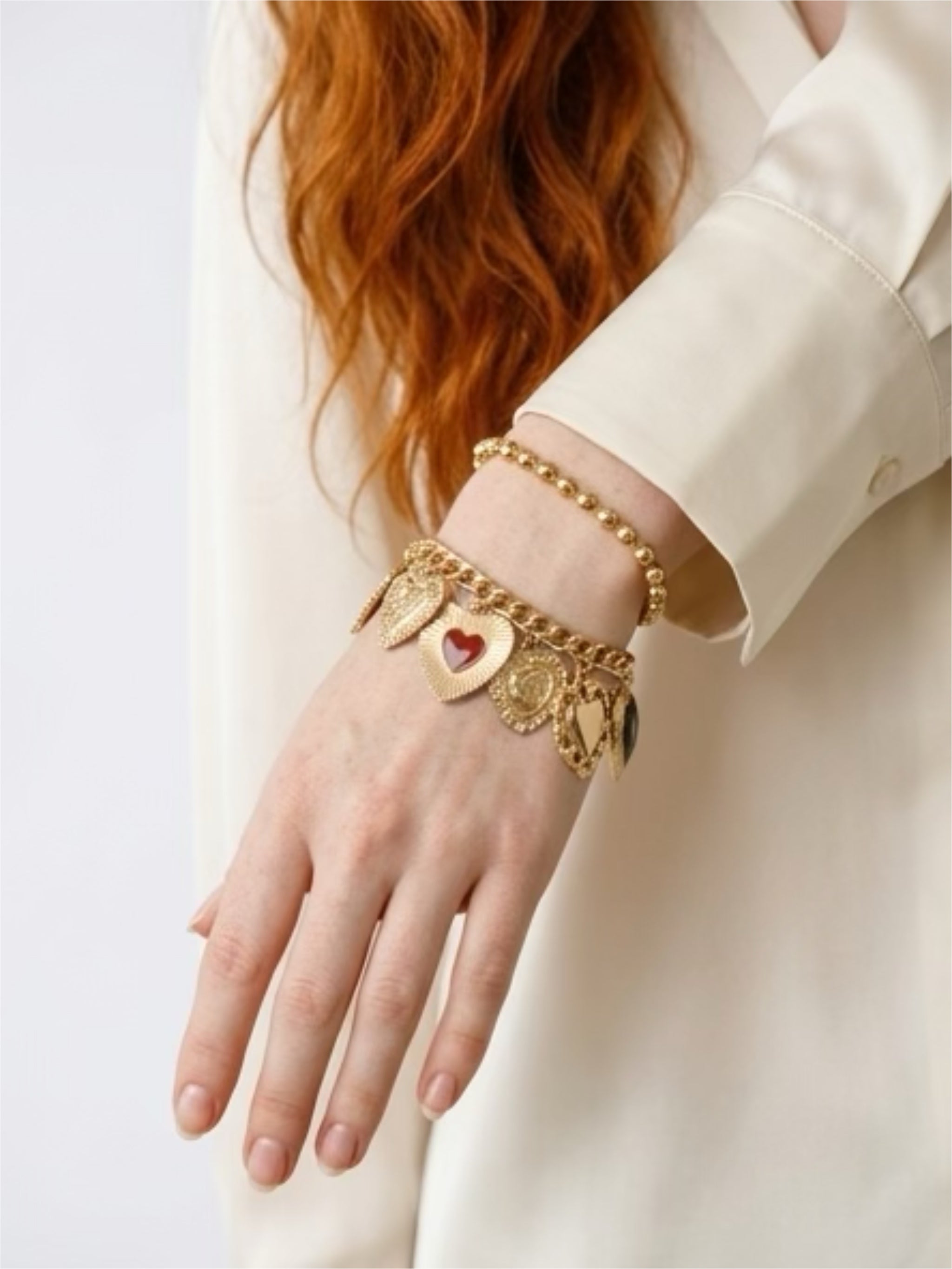 Dúo pulseras dijes corazón